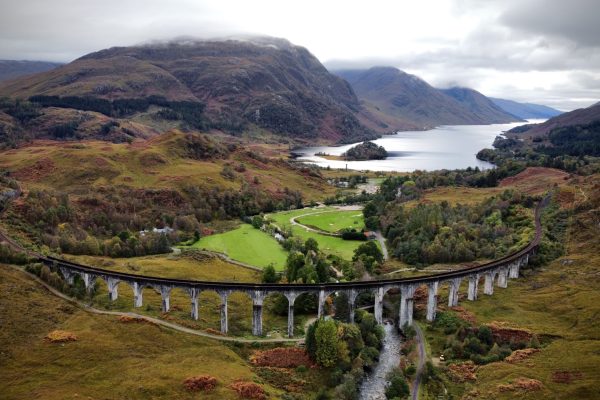 Glenfinnan Viaduct, popular among Harry Potter fans, with the Glenfinnan Monument and Loch Shiel in the background